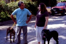 Photo: Cesar with client and her dogs